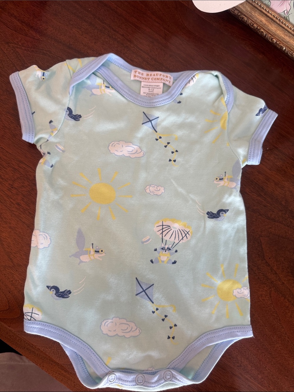 The Beaufort Bonnet Company Light Blue Pastel Sky Print Onesie
